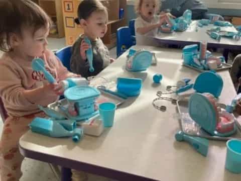 a group of children playing with toys