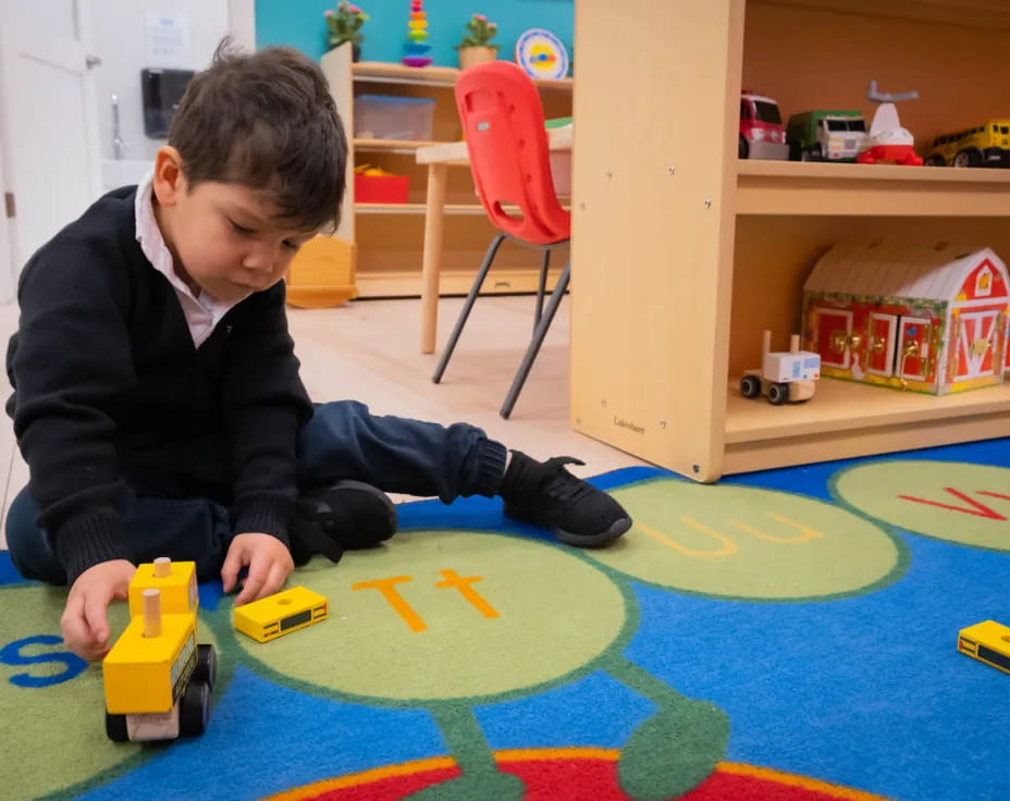 a boy playing with toys