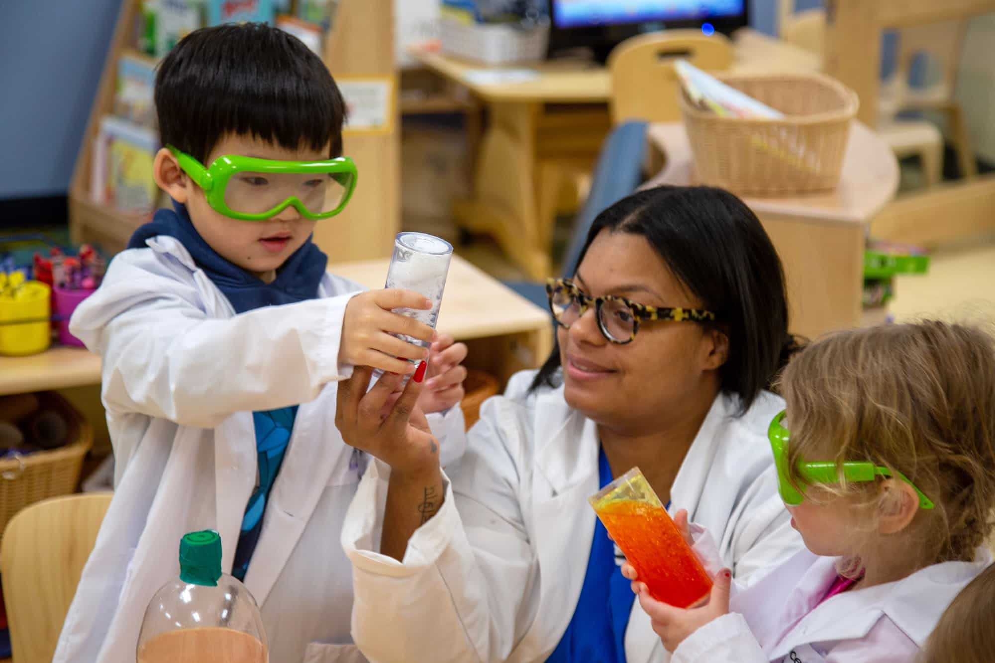 a group of people wearing lab coats and goggles