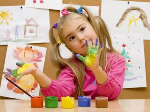 a young girl painting