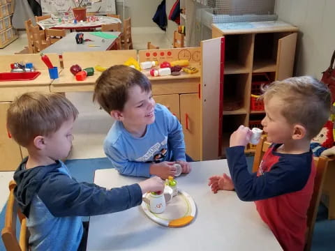 a group of boys playing with toys