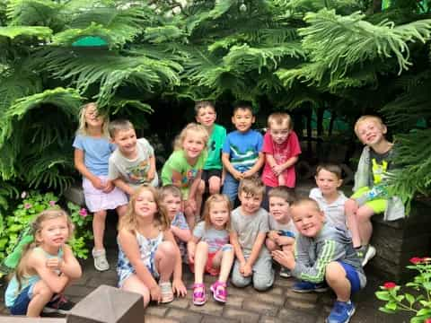 a group of children posing for a photo