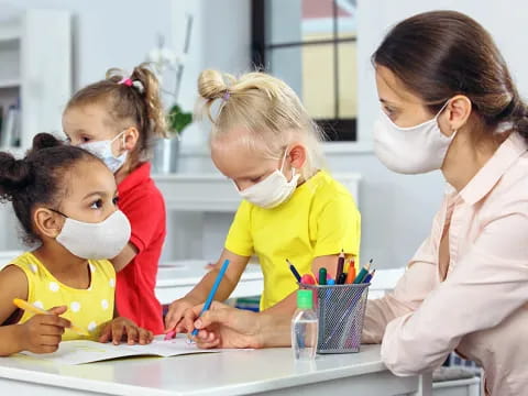 a woman and children in a lab