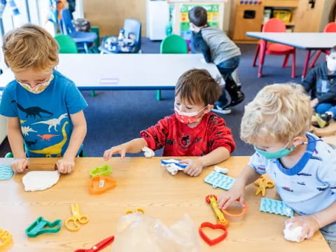 a group of children playing with toys