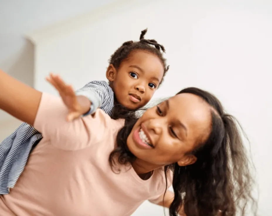 a person holding a child