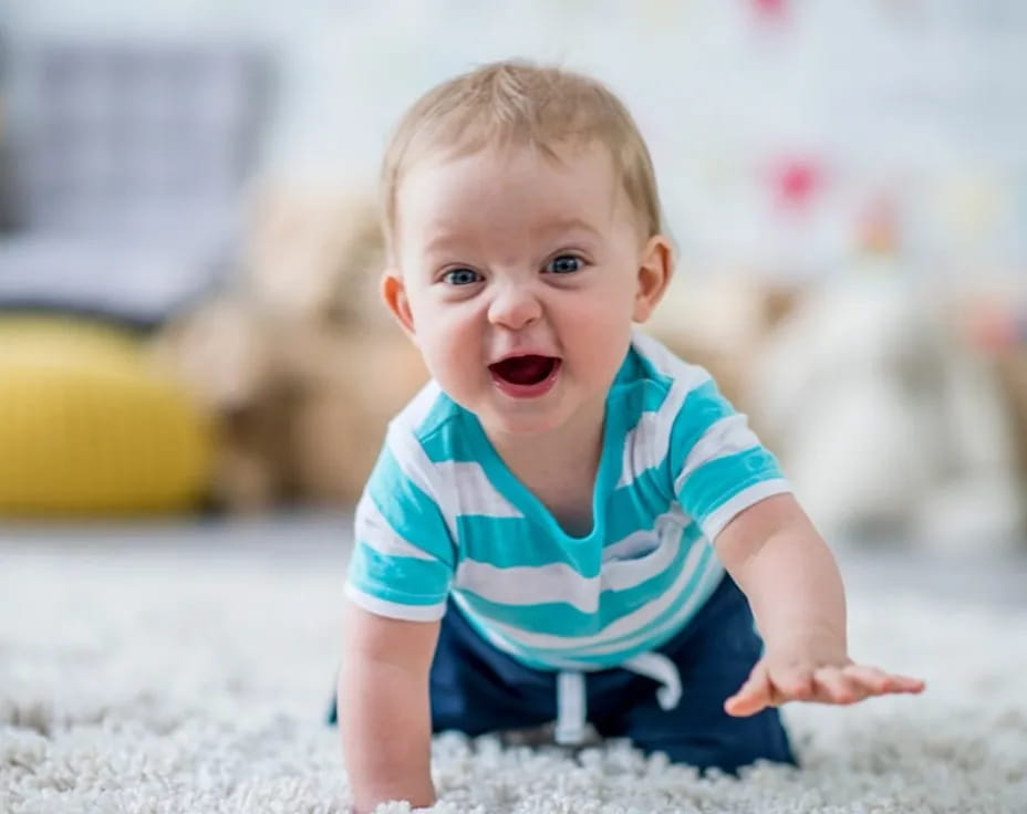 a baby crawling on the ground
