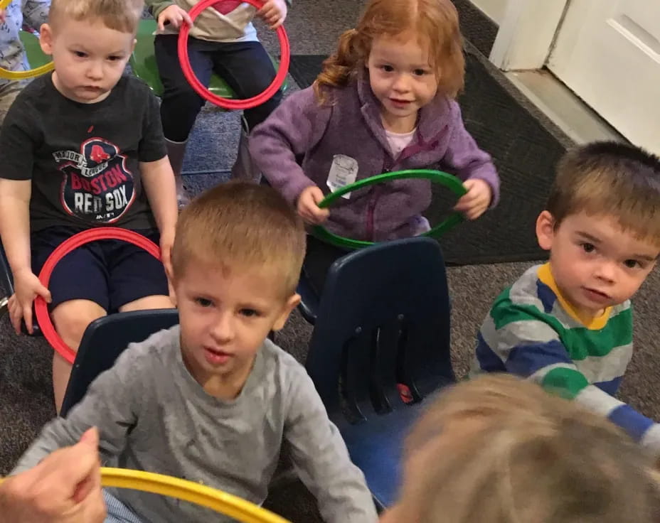 a group of children sitting on the floor