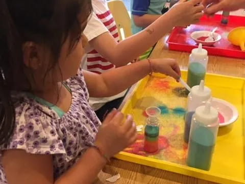 a group of people painting