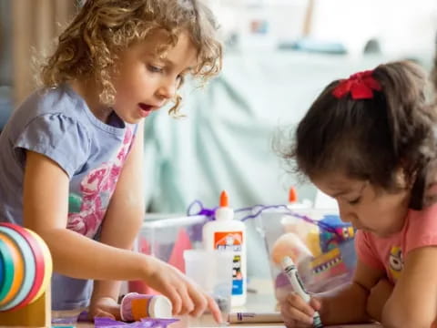 medium shot of kids using a microscope