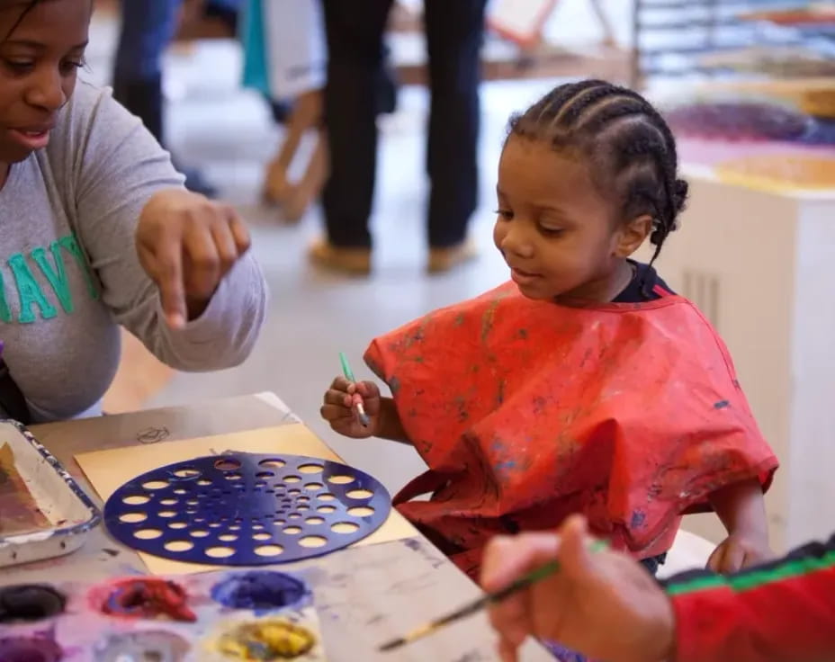 a young girl painting