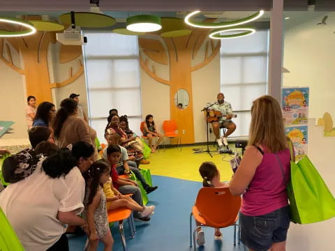 a group of people sitting in a room