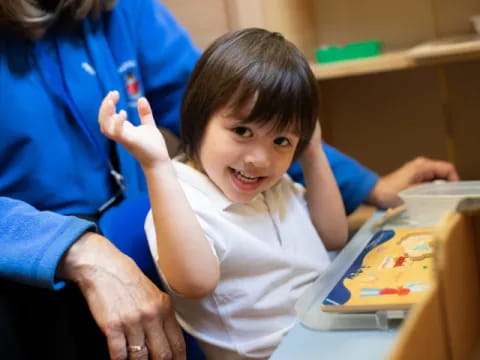 a child smiling at the camera