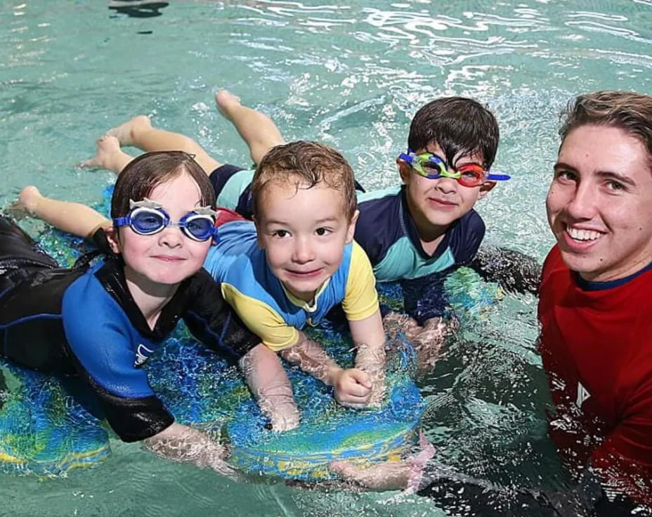 a group of people in a pool