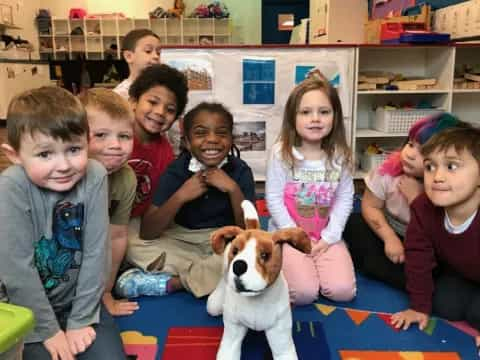 a group of children and a dog