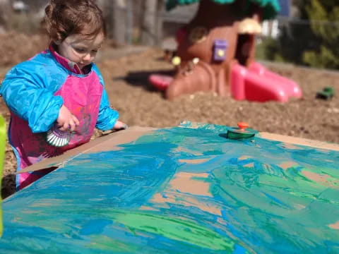 a child playing in a pool