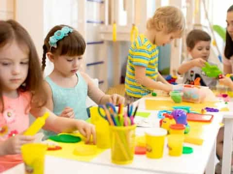 children painting on a table