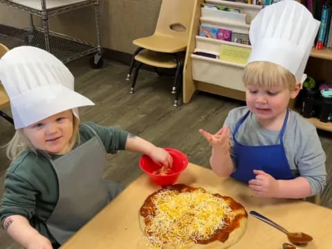 kids wearing paper crowns and eating pizza