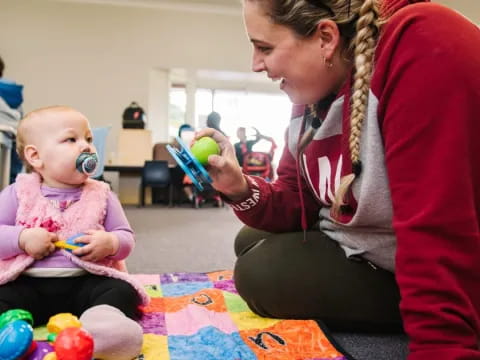 a person holding a baby