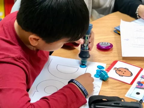 a child drawing on a table