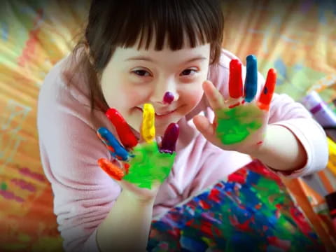 a girl holding a toy