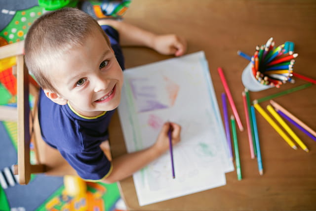 a child sitting at a table