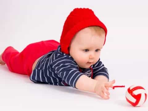 a baby wearing a santa hat