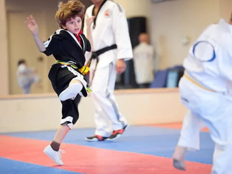 a boy in a karate uniform