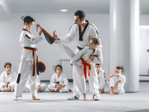 a group of people in karate uniforms