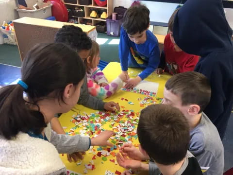 a group of children playing a board game