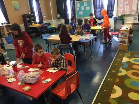 a group of children sitting at tables