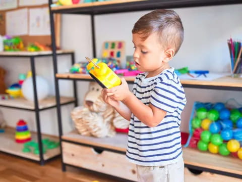 a child holding a toy