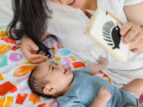 a woman holding a baby