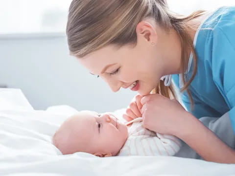 a person holding a baby