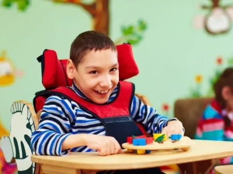 a boy sitting at a table