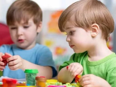 a couple of boys playing with toys