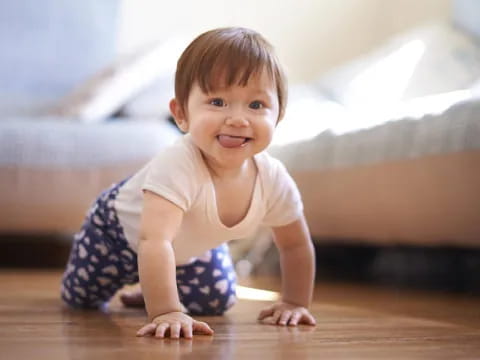 a baby crawling on the floor