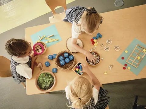 a group of children playing a board game