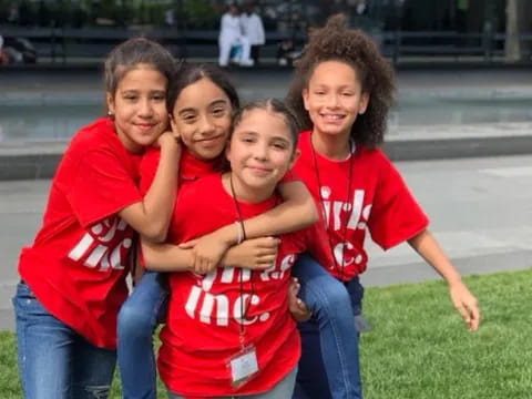 a group of girls posing for a picture