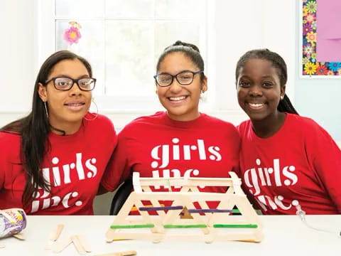 a group of girls smiling