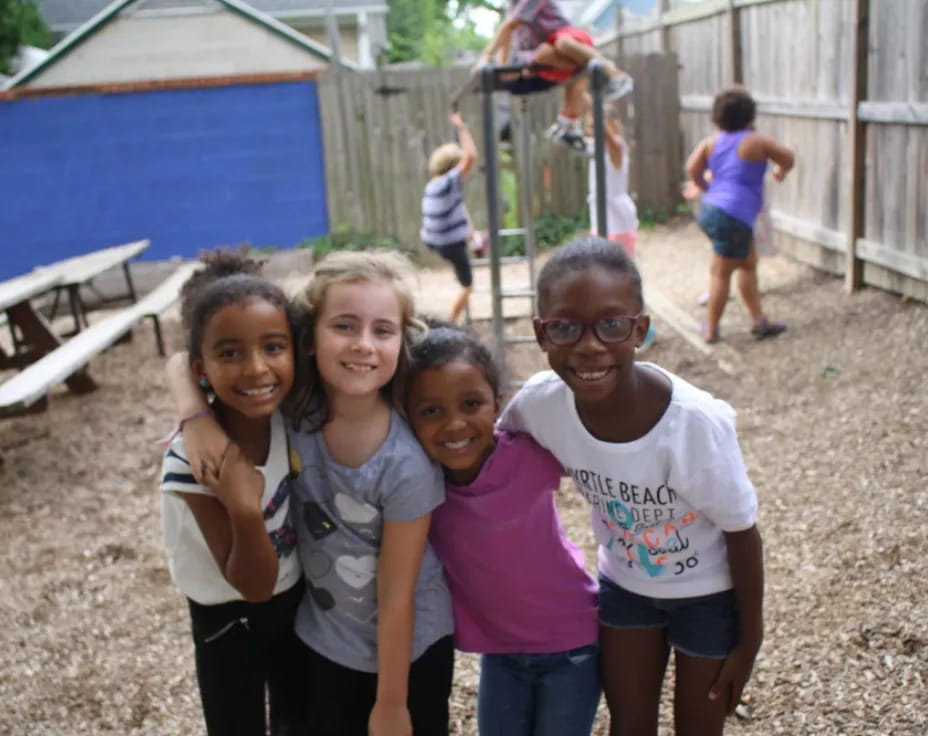 a group of girls posing for a photo