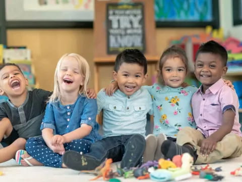 a group of children sitting on the floor