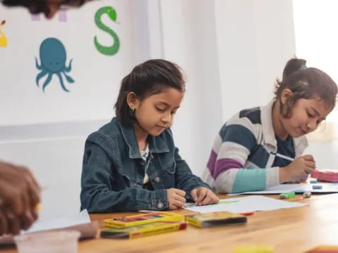 a few women studying at a table