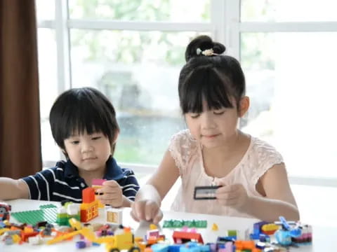 a couple of kids playing with toys