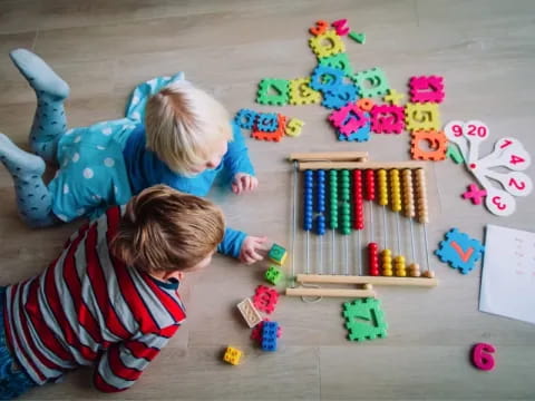 a couple of kids playing with toys