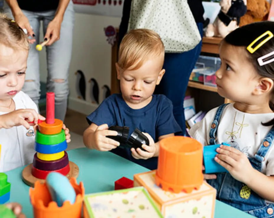 a group of children playing with toys