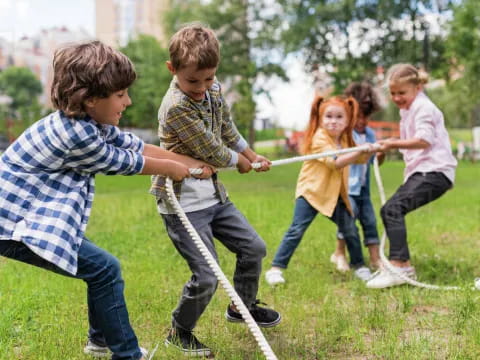 a group of children playing with a toy sword