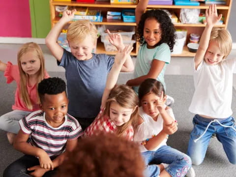 a group of children sitting on the floor