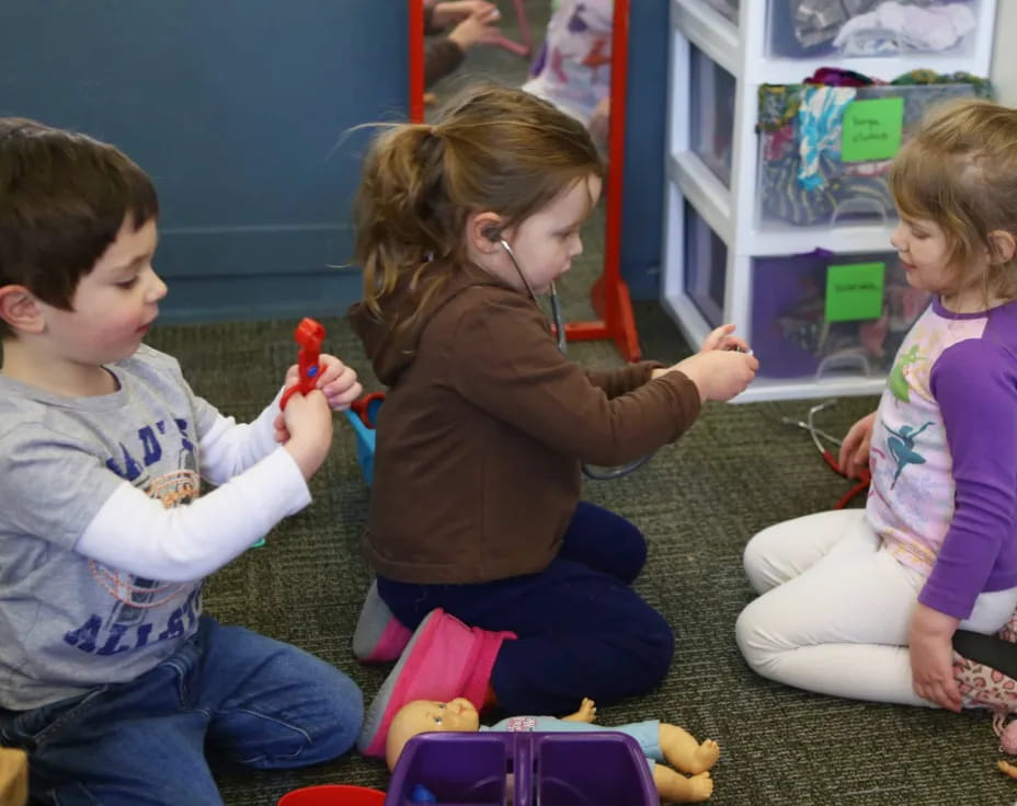 a group of children playing with toys