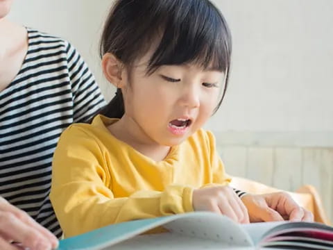 a baby looking at a book