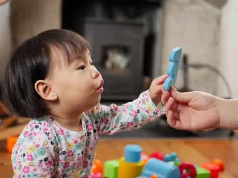 a baby playing with a toy